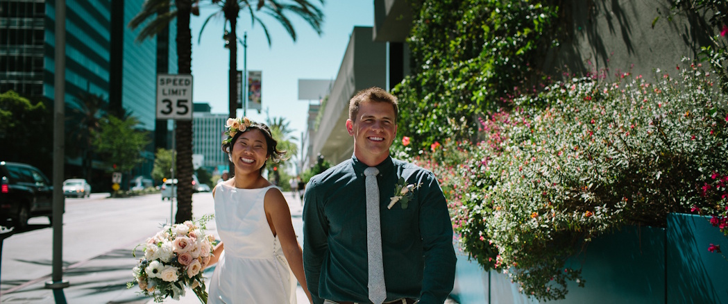 happy couple walking down la street happy couple walking down la street