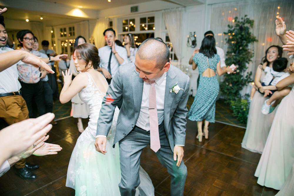 happy couple dancing at wedding reception