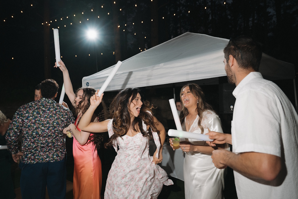 bride and guests dancing at reception